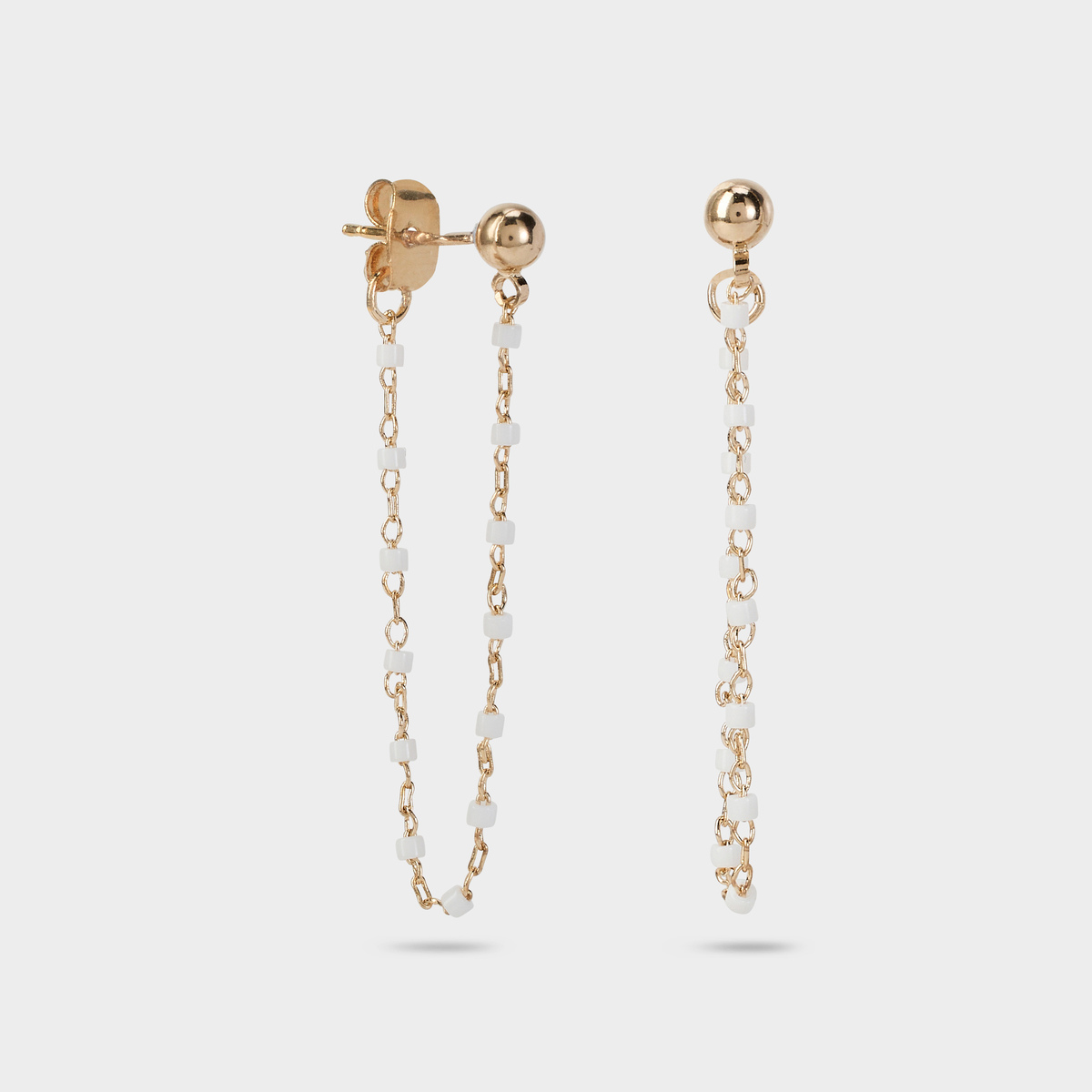 Boucles d'oreilles Mahos devant derrière blanches plaqué or