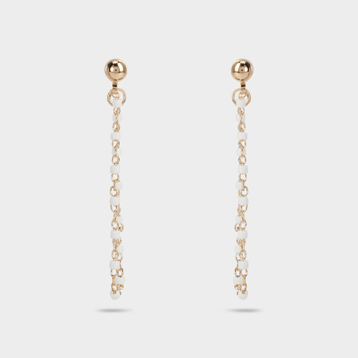 Boucles d'oreilles Mahos devant derrière blanches plaqué or