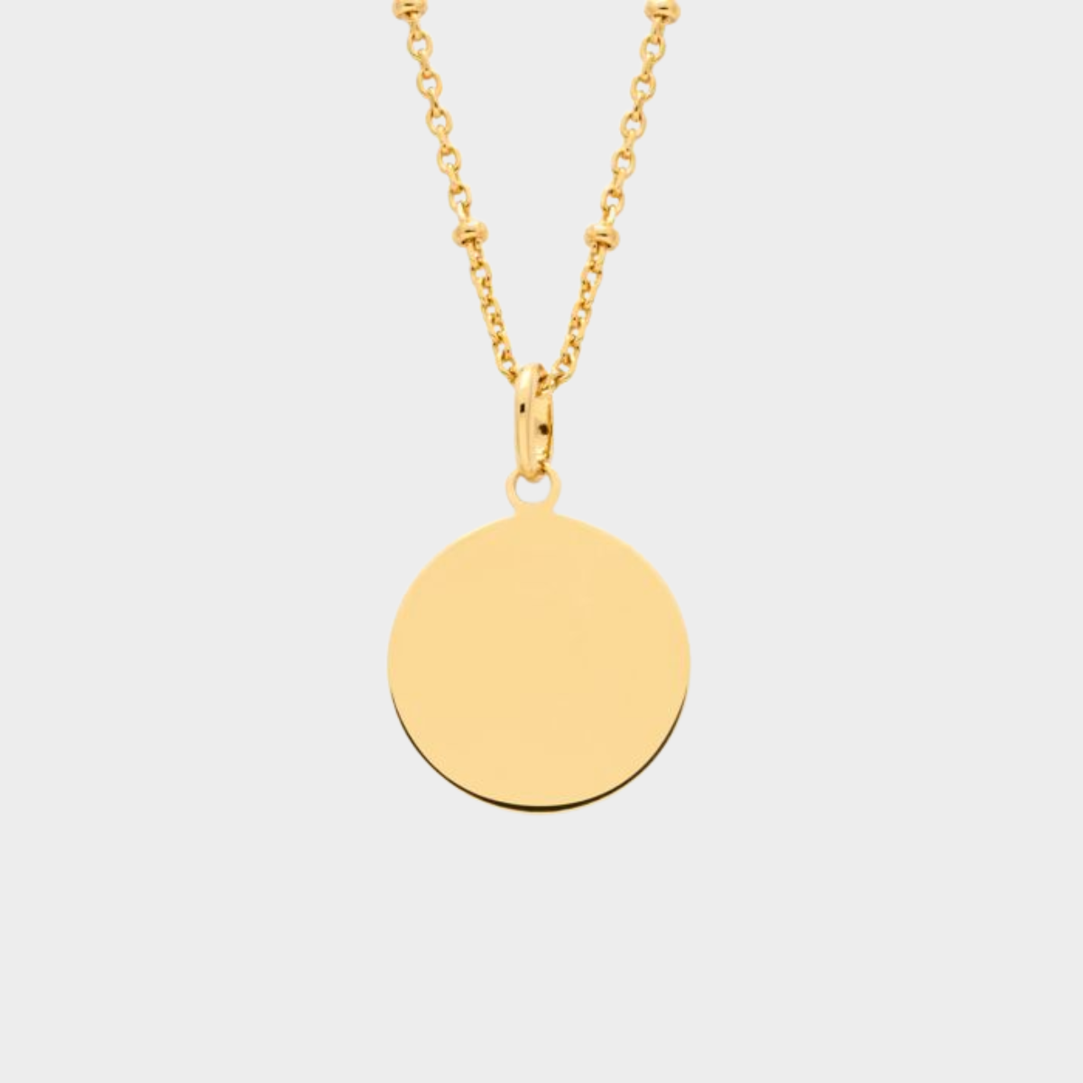 Pendentif médaille sur chaîne perlée plaqué or