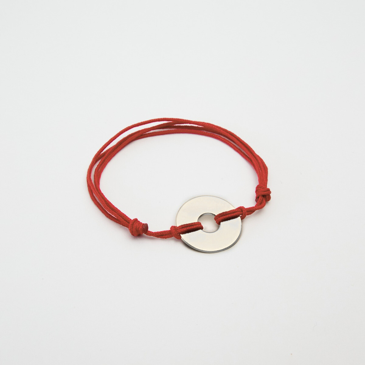Bracelet petite cible argent sur lien coton
