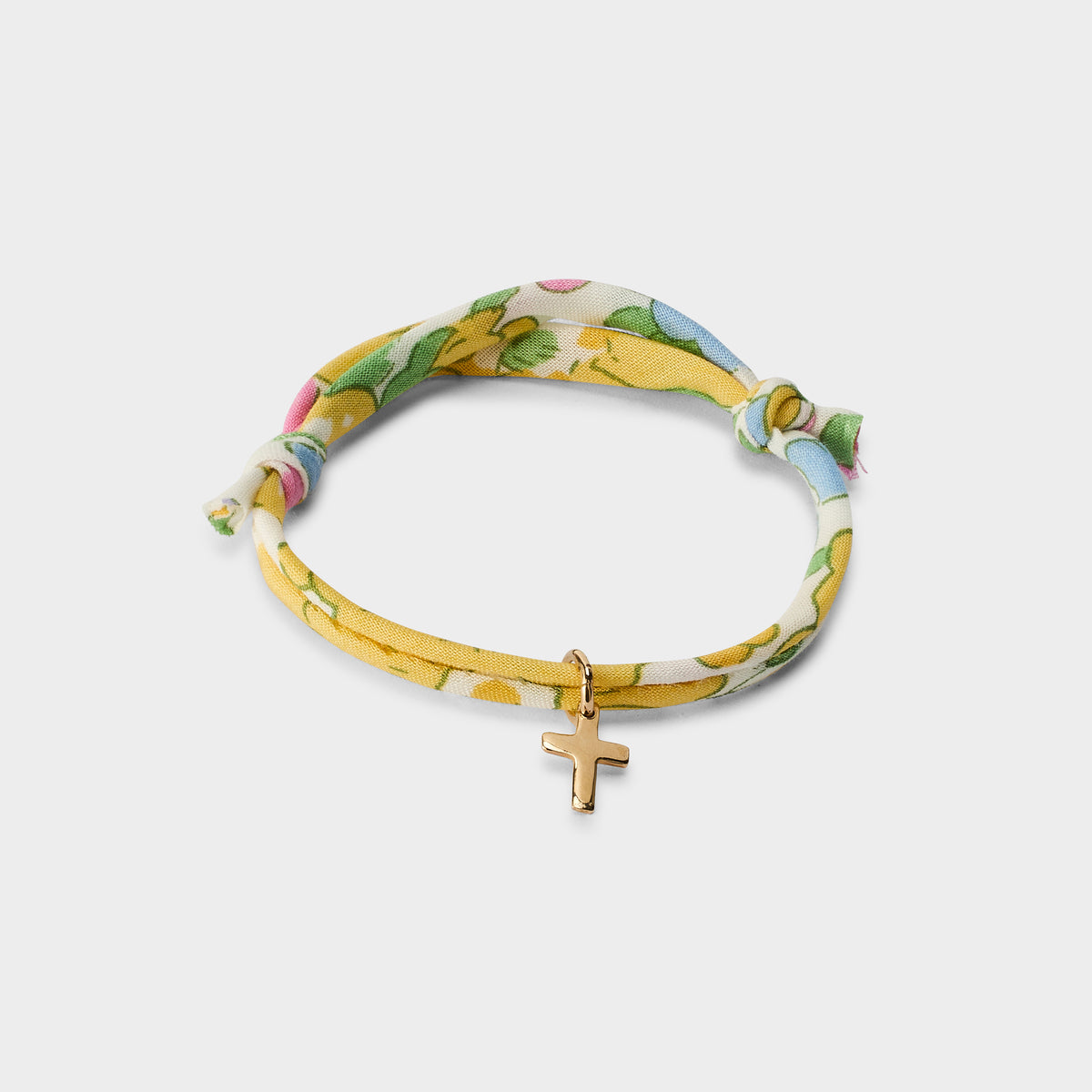 Bracelet croix plaqué or sur cordon liberty
