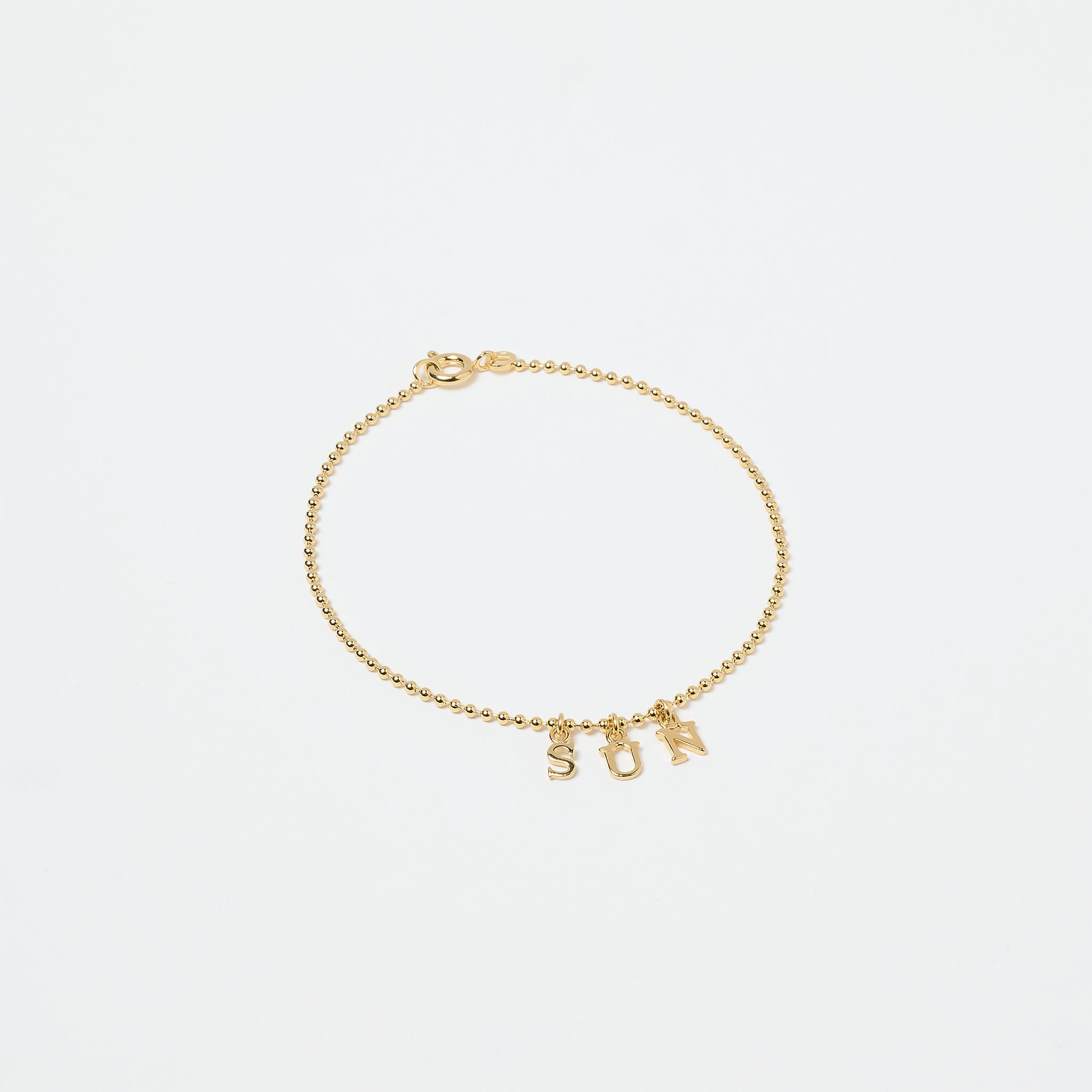 Bracelet lettres plaqué or