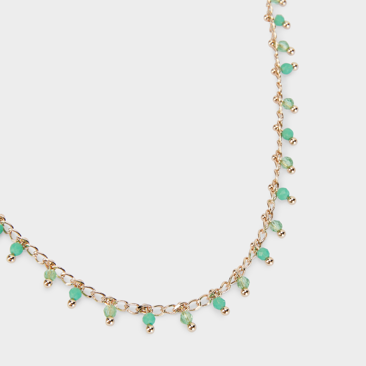 Collier pampilles facettées vertes plaqué or