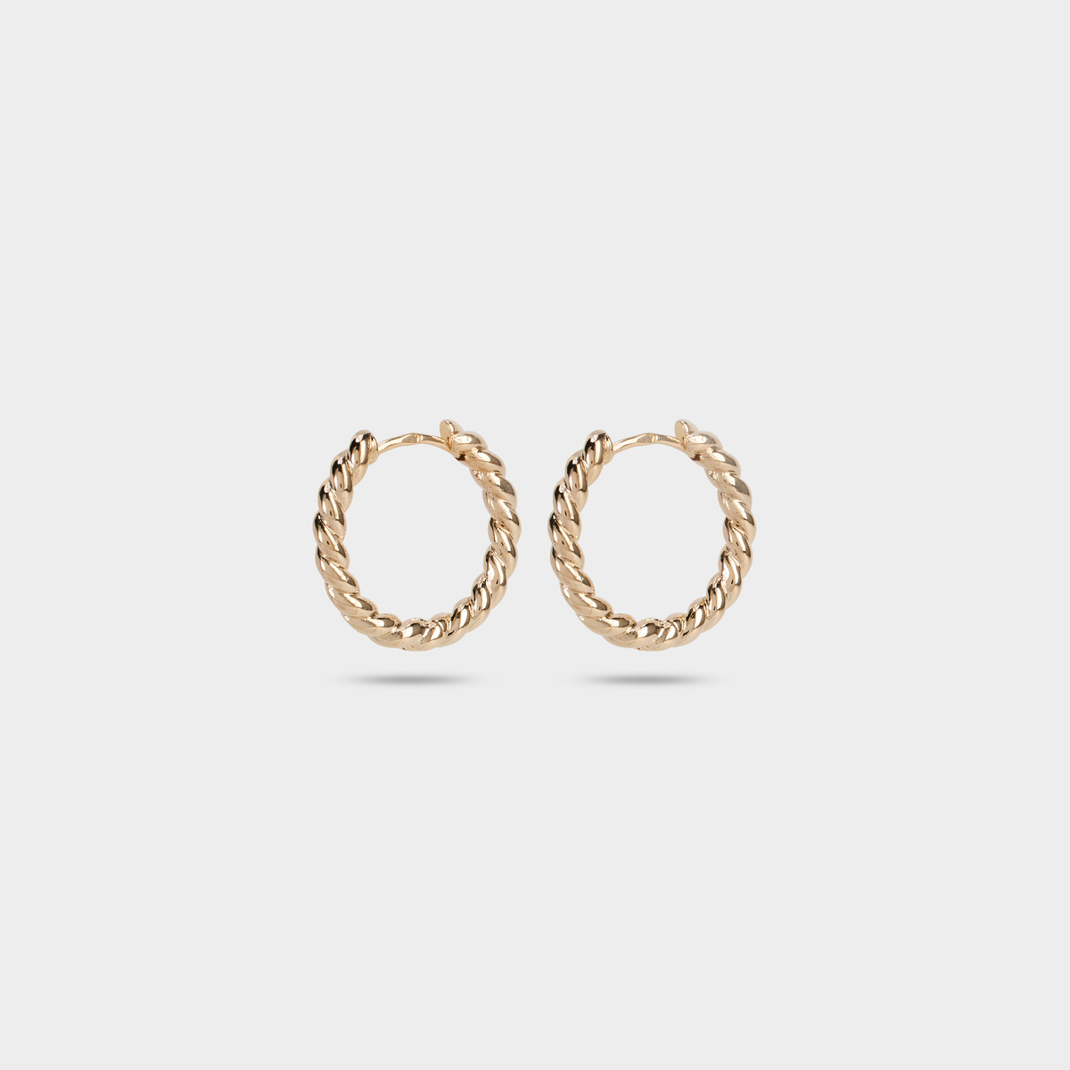 Boucles d'oreilles créoles torsadées plaqué or