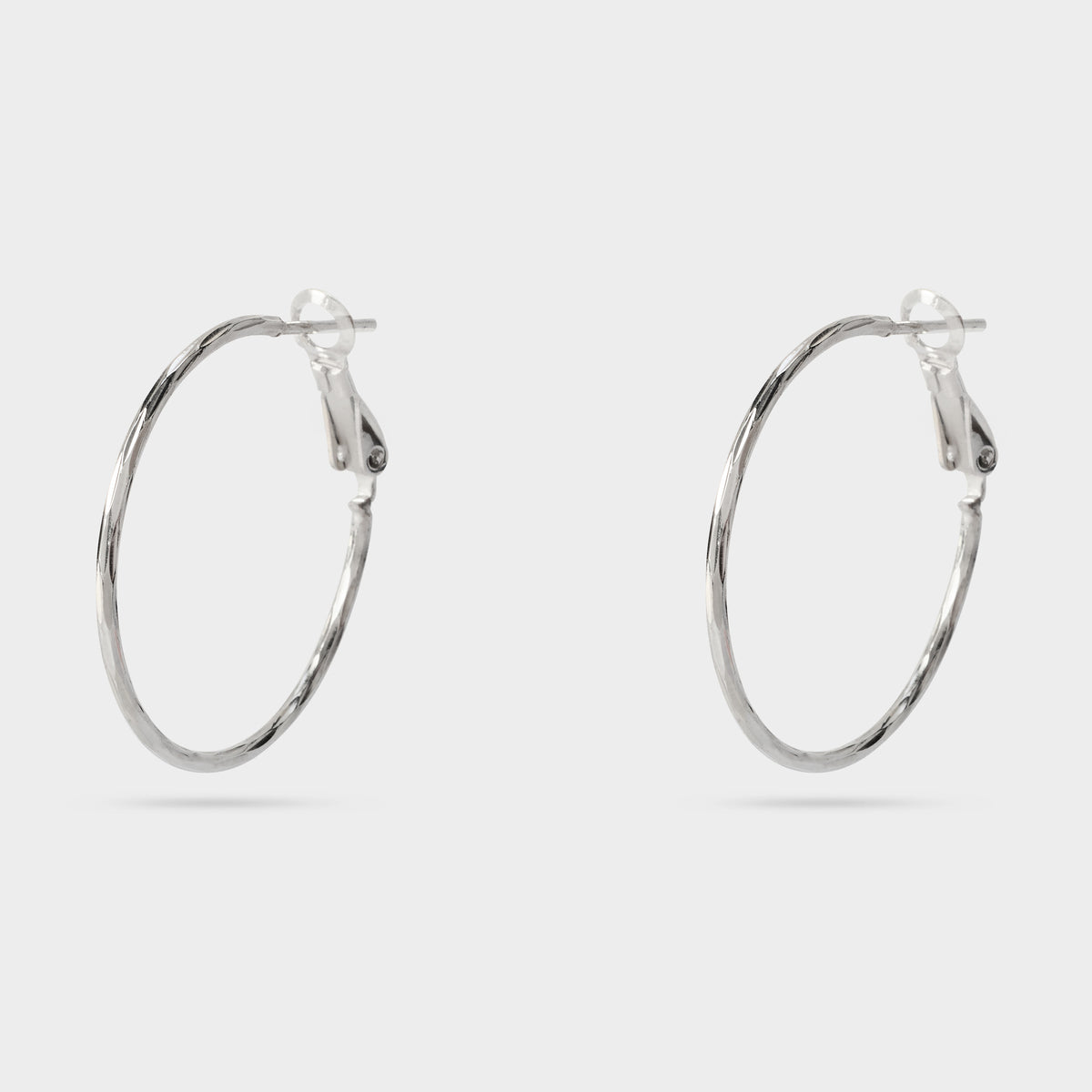 Boucles d'oreilles moyennes créoles torsadées argent