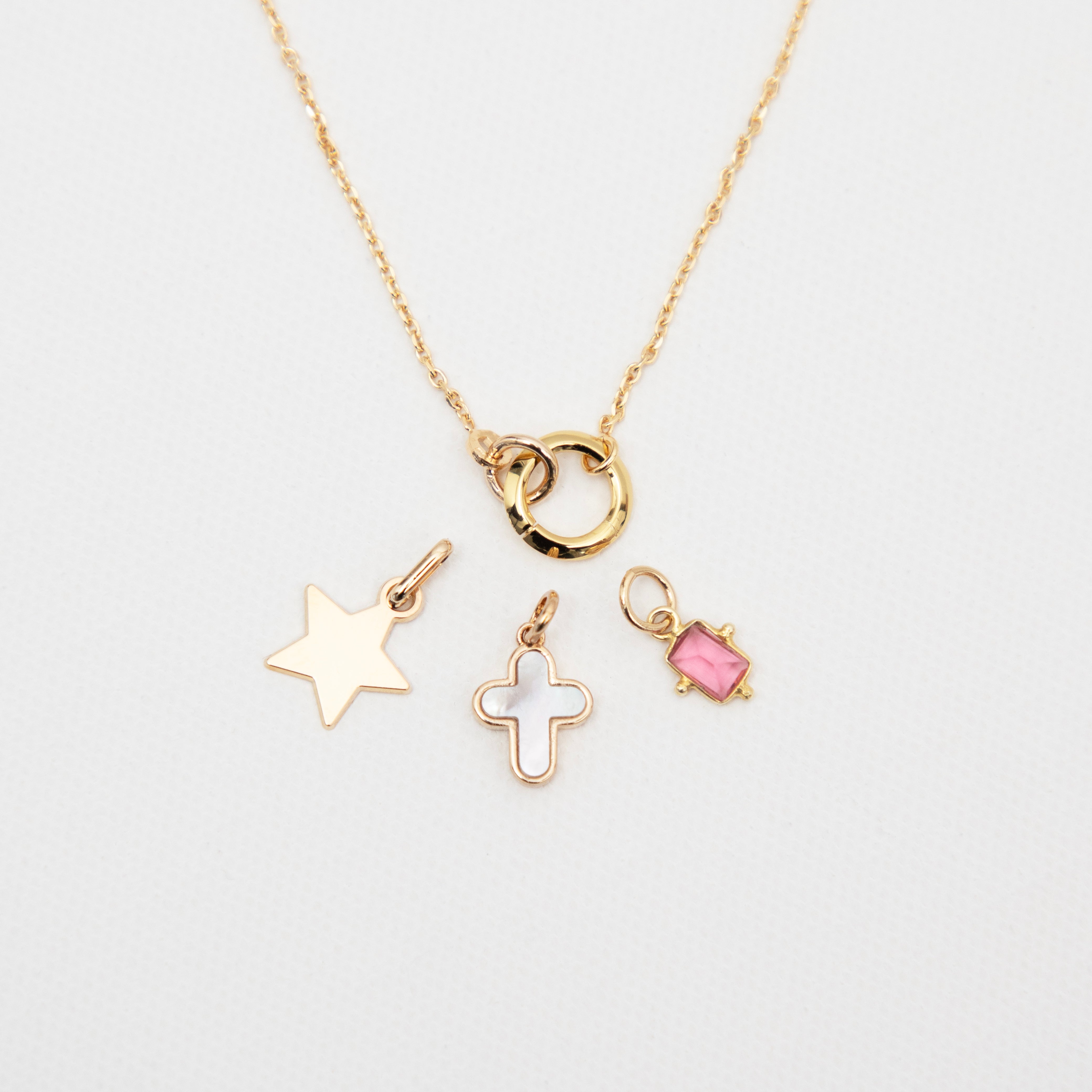 Gris-gris mini croix plaqué or et nacre