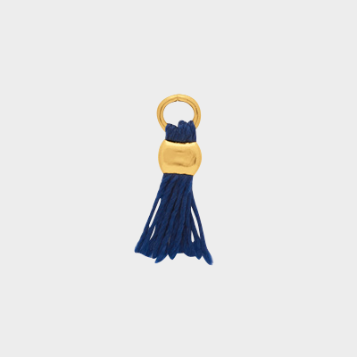 Mini pompon plaqué or bleu marine