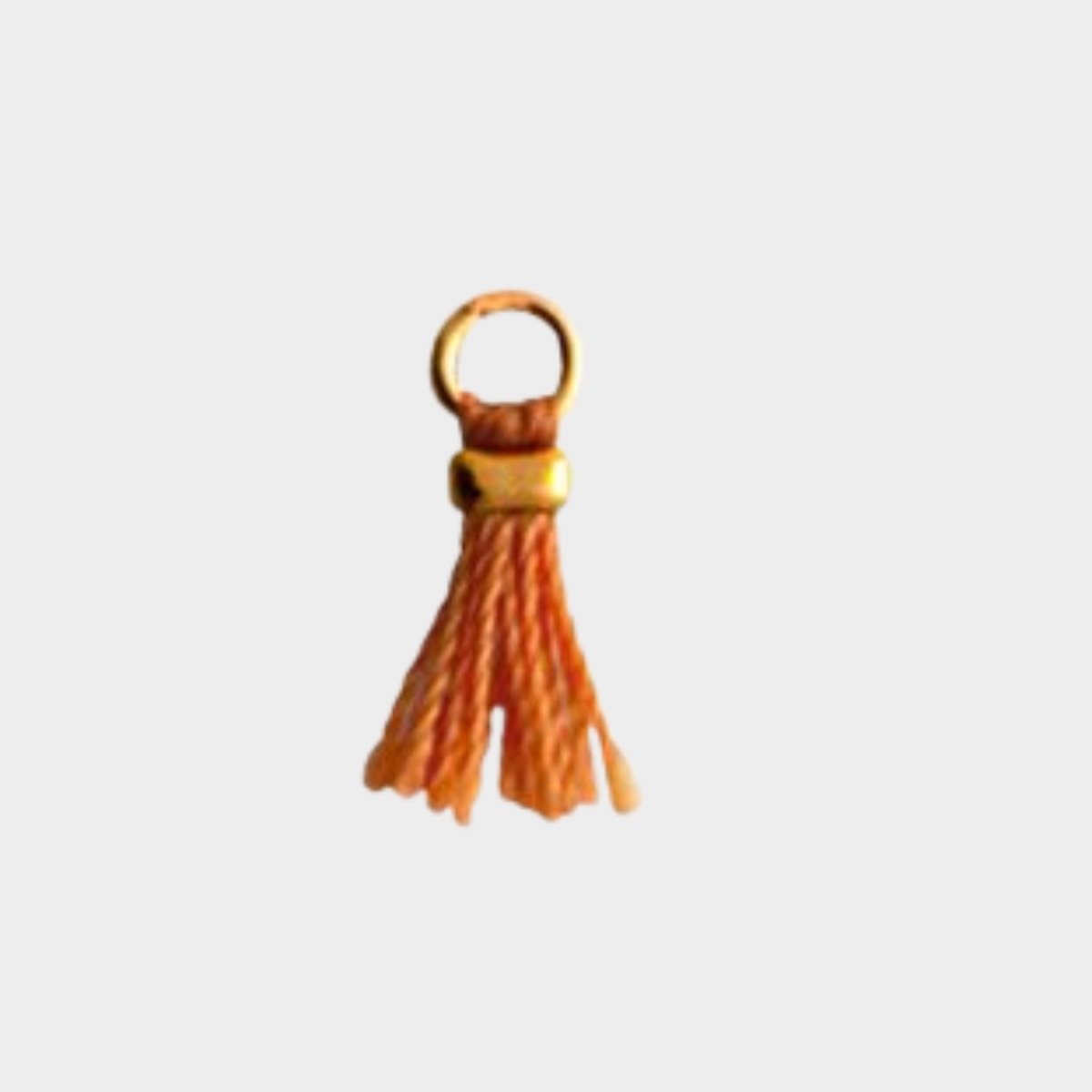 Mini pompon plaqué or orange