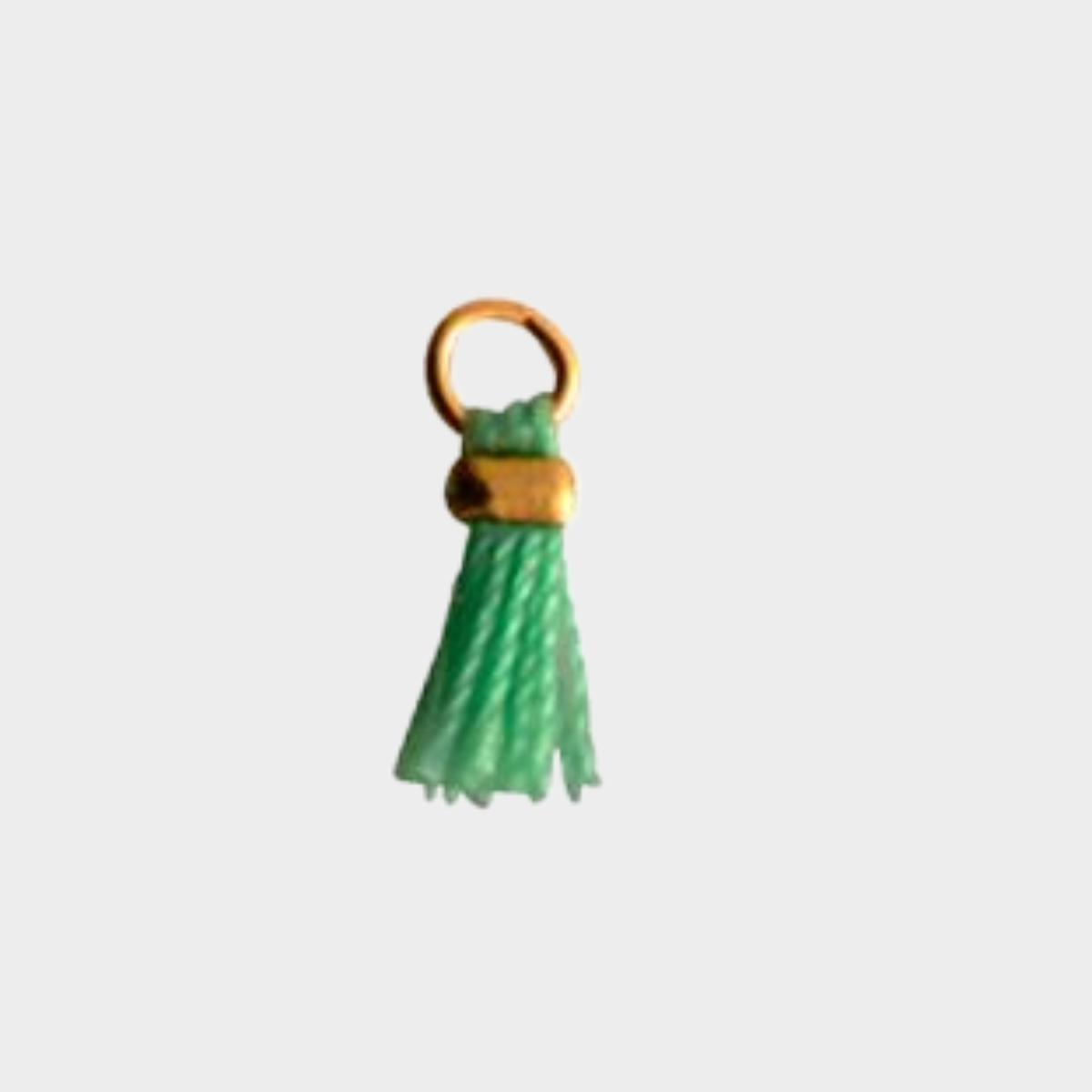 Mini pompon plaqué or vert anis