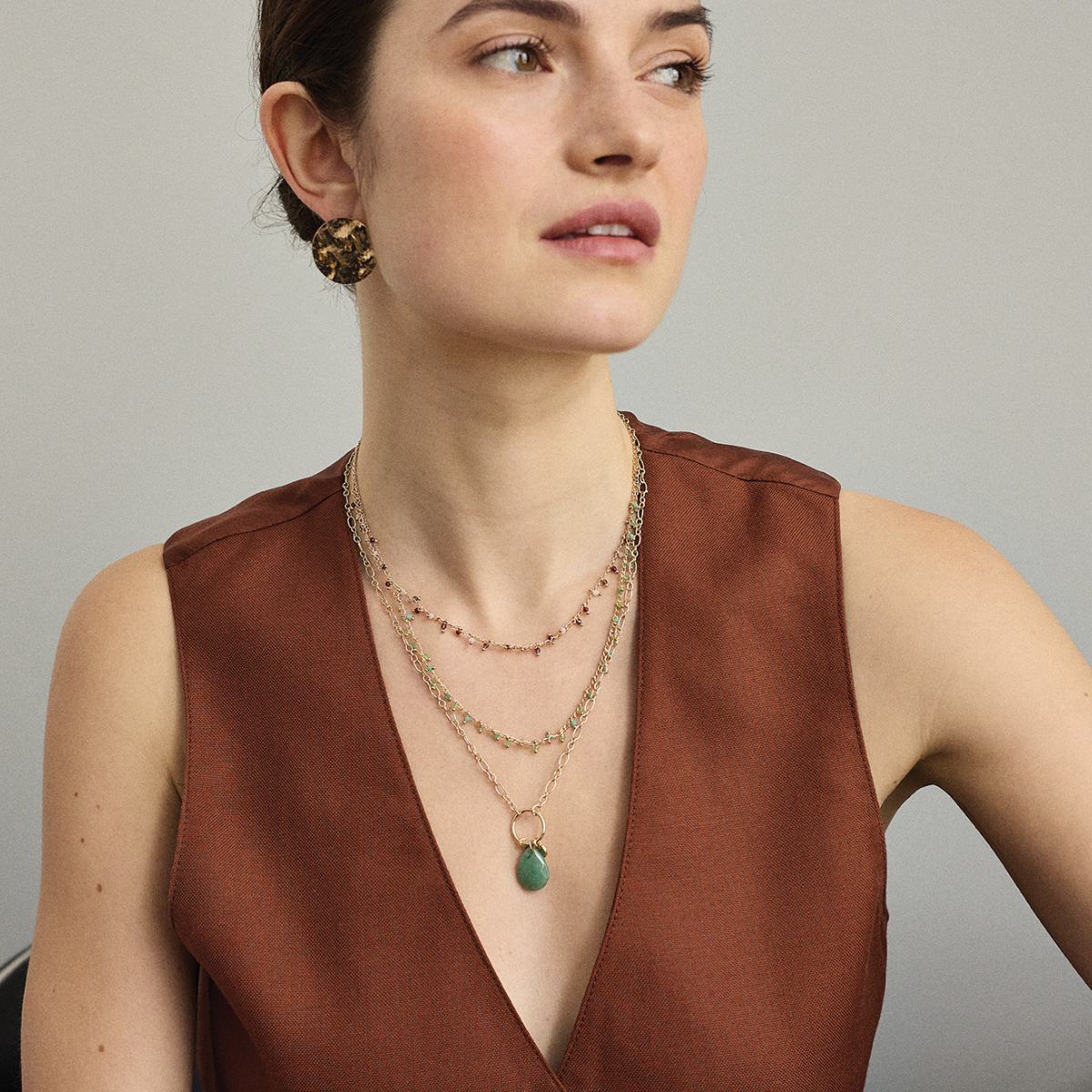 Collier pampilles facettées vertes plaqué or